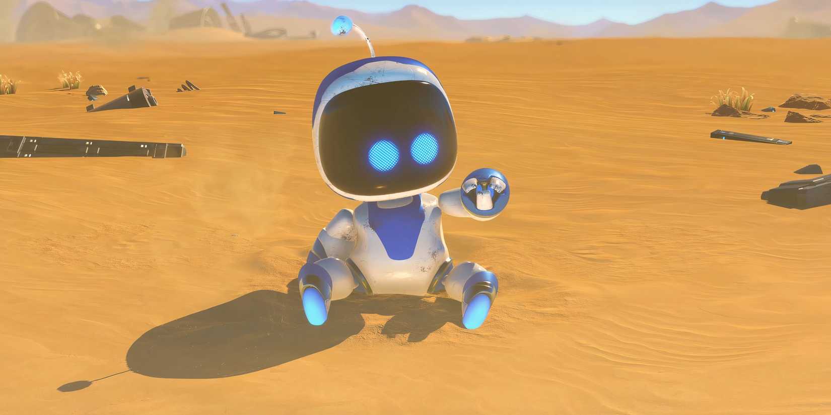 Astro Bot sitting in a sandy area.