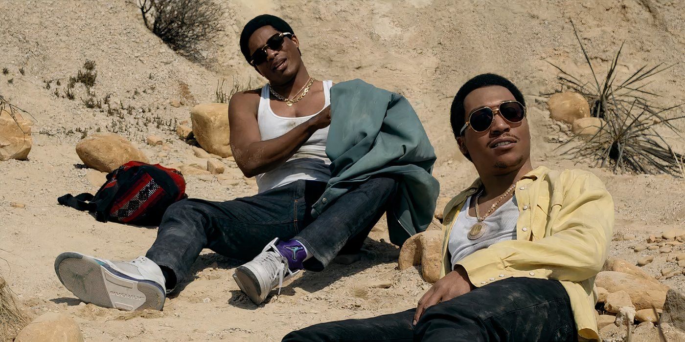 Meech and Terry sit on rocks in the desert in Mexico in BMF season 4.