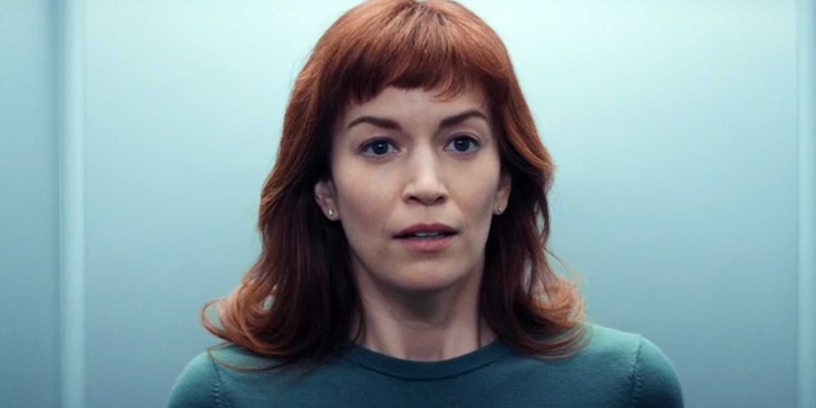 Britt Lower as Helly looking nervous standing in the elevator in Severance's season 1 finale