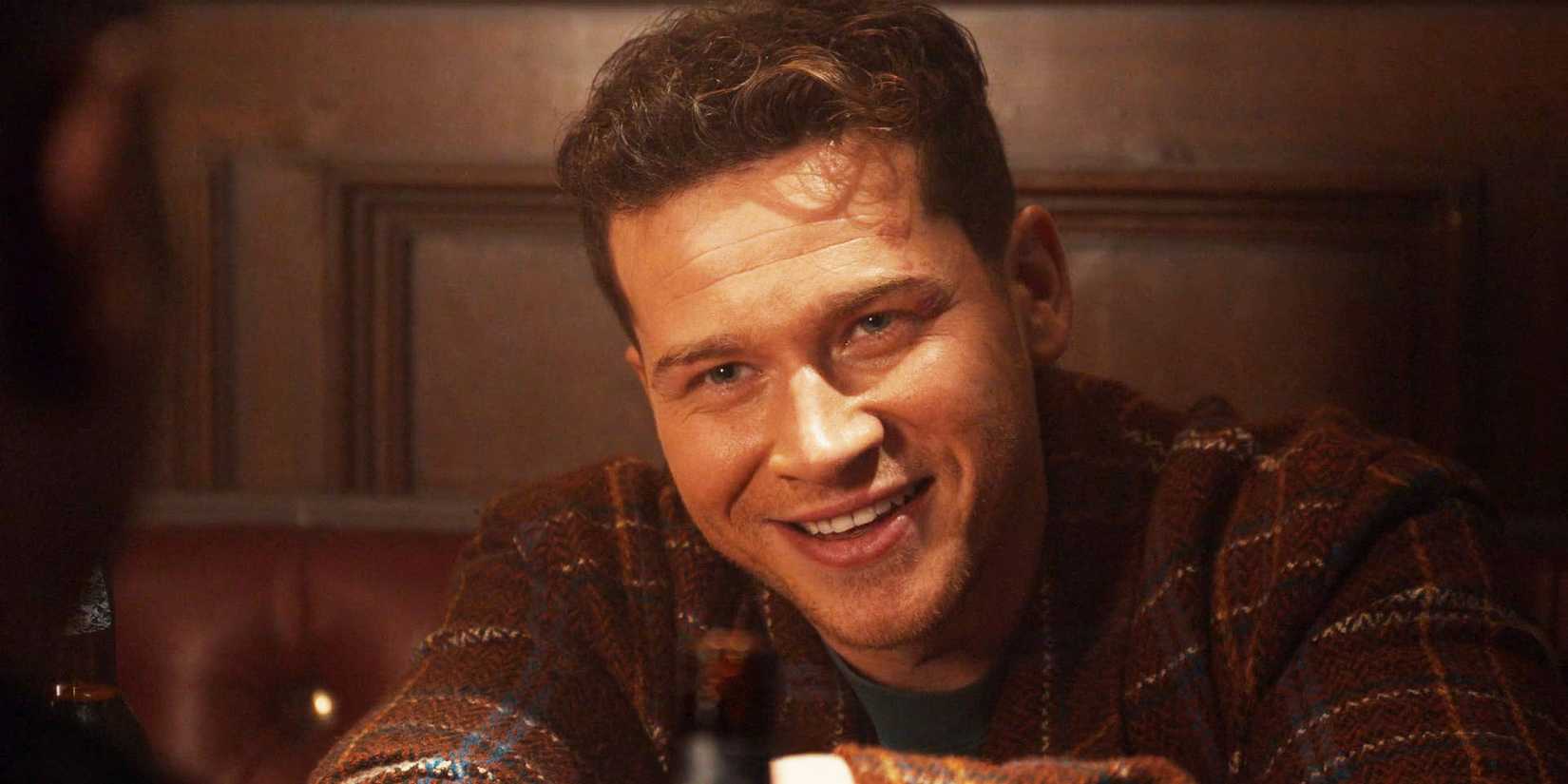 Buck (Oliver Stark) smiling at Tommy in 9-1-1 season 8, episode 11