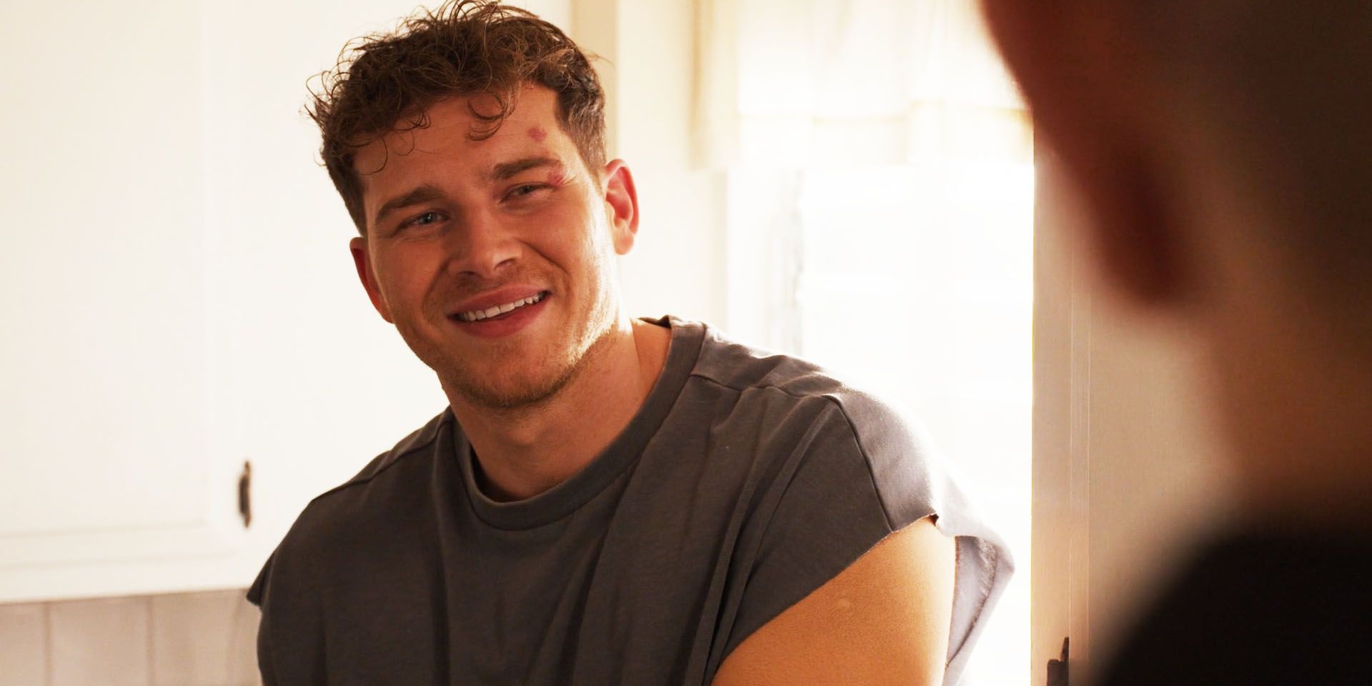 Buck (Oliver Stark) smiling at Tommy the morning after in 9-1-1 season 8, episode 11