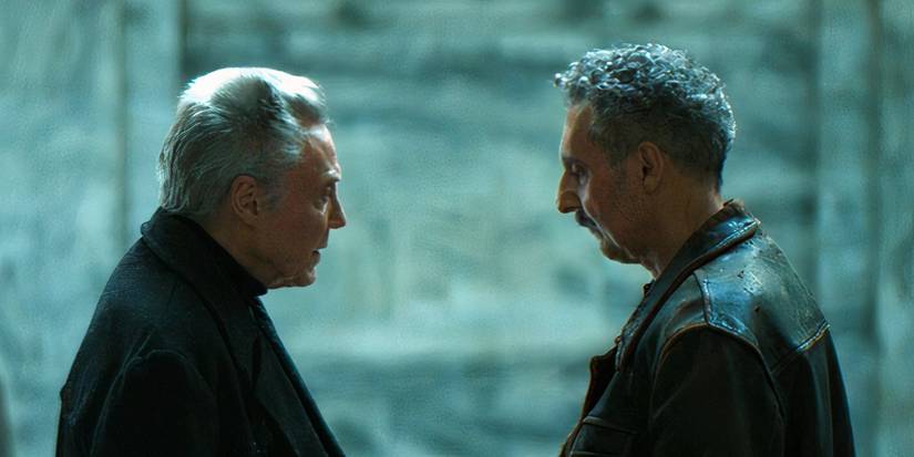 Burt and Irving standing across from each other in a train station in Severance season 2 (2025)