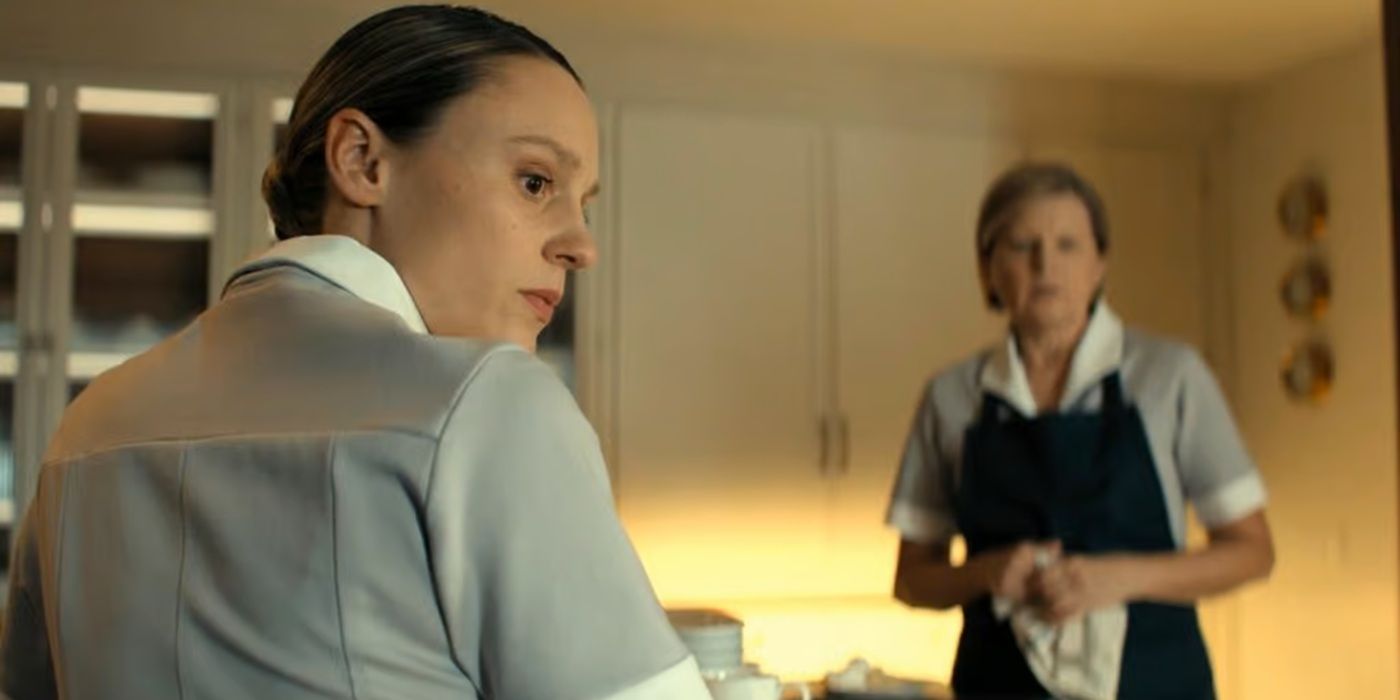 Annette looking at Jack Reacher while working in the kitchen in Reacher season 3