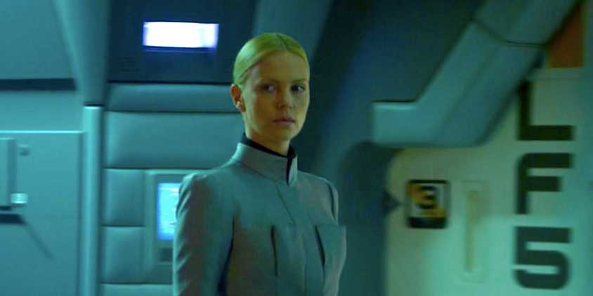 Charlize Theron's Meredith stands in a spaceship frowning from Prometheus