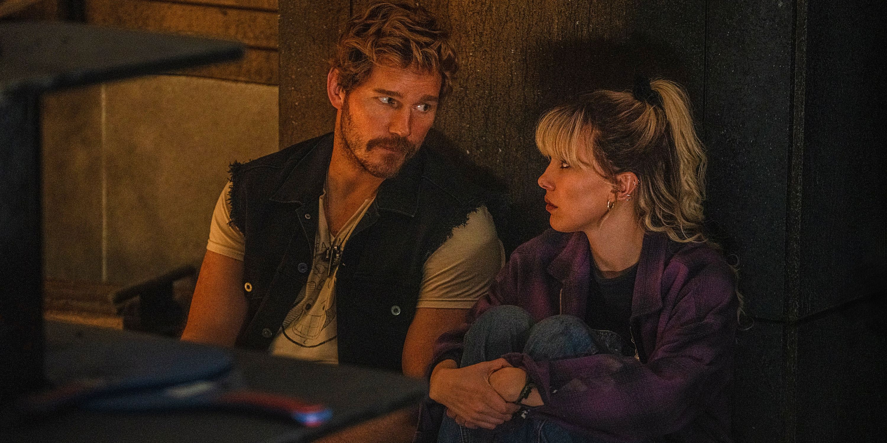 Chris Pratt and Millie Bobby Brown are looking at each other in Electric State