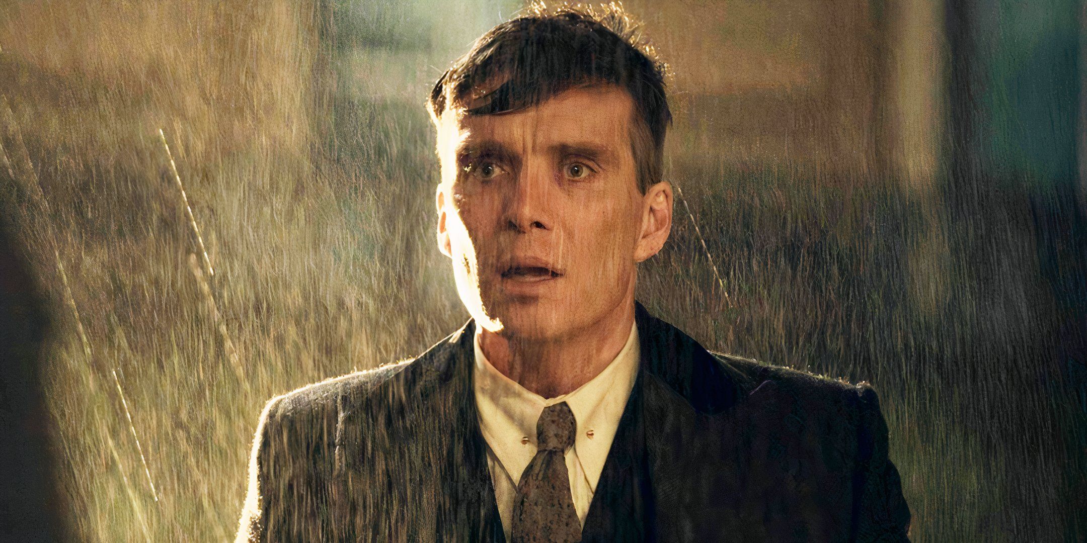 Cillian Murphy looking shocked in the rain as Tommy Shelby in Peaky Blinders