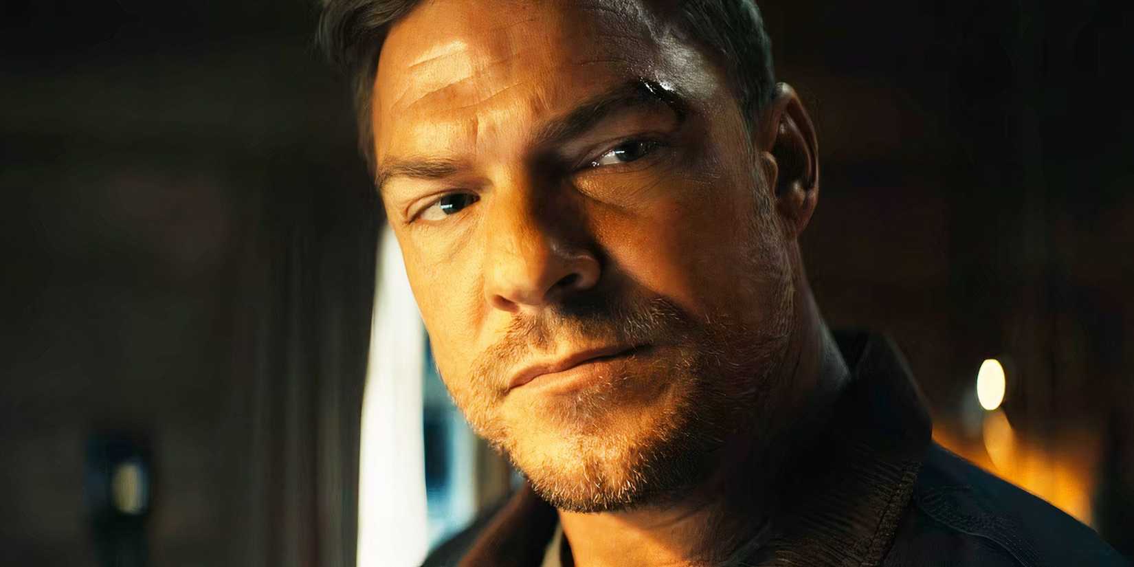 Alan Ritchson as Reacher giving an intense stare in Reacher