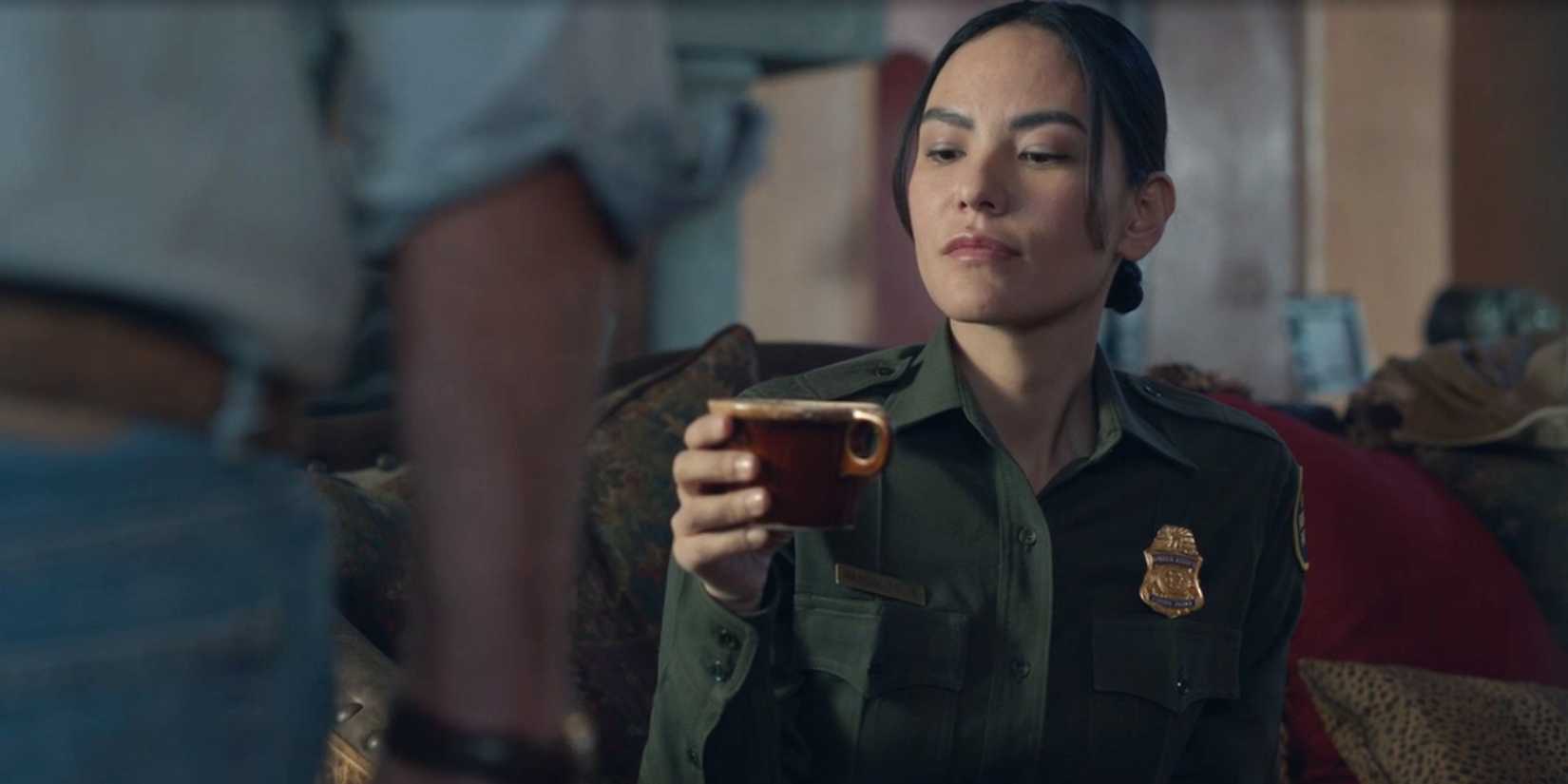 Bernadette Manuelito (Jessica Matten) holds a cup of coffee in Dark Winds season 3, episode 3
