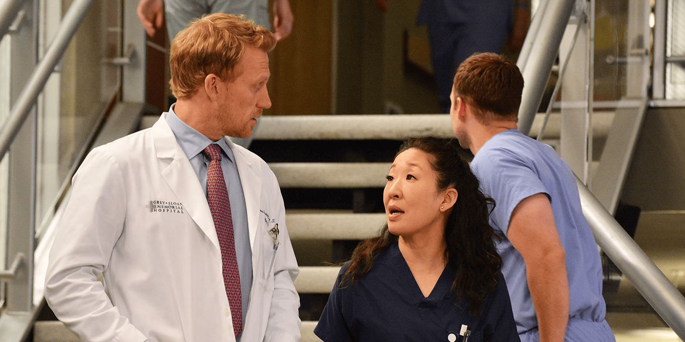 cristina and owen walking in the hospital together in grey's anatomy