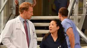 cristina and owen walking in the hospital together in grey's anatomy