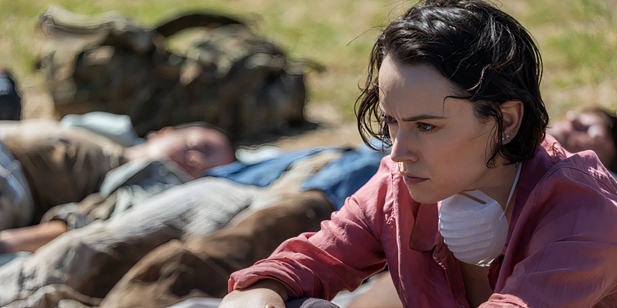 Daisy Ridley as Ava looking upset while sitting next to ᴅᴇᴀᴅ bodies in We Bury the ᴅᴇᴀᴅ