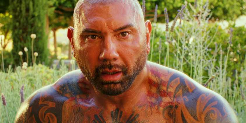 Dave Bautista looking shocked while shirtless in Glass Onion