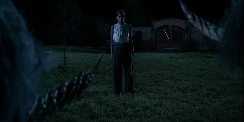 Sunita Mani as Dr. Bhatia looking scared at the unicorn parents in Death of a Unicorn