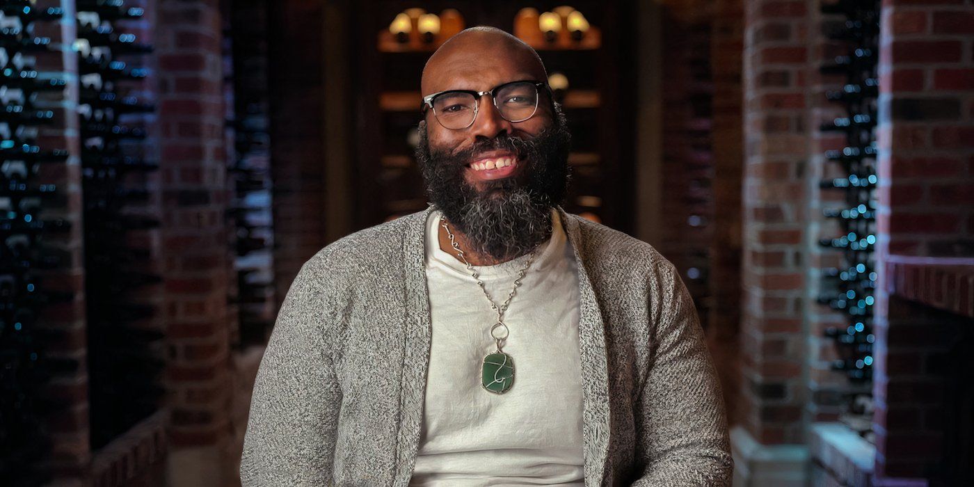 Million Dollar Secret season 1 Dr. Phillip J. Roundtree in a gray sweater smiling