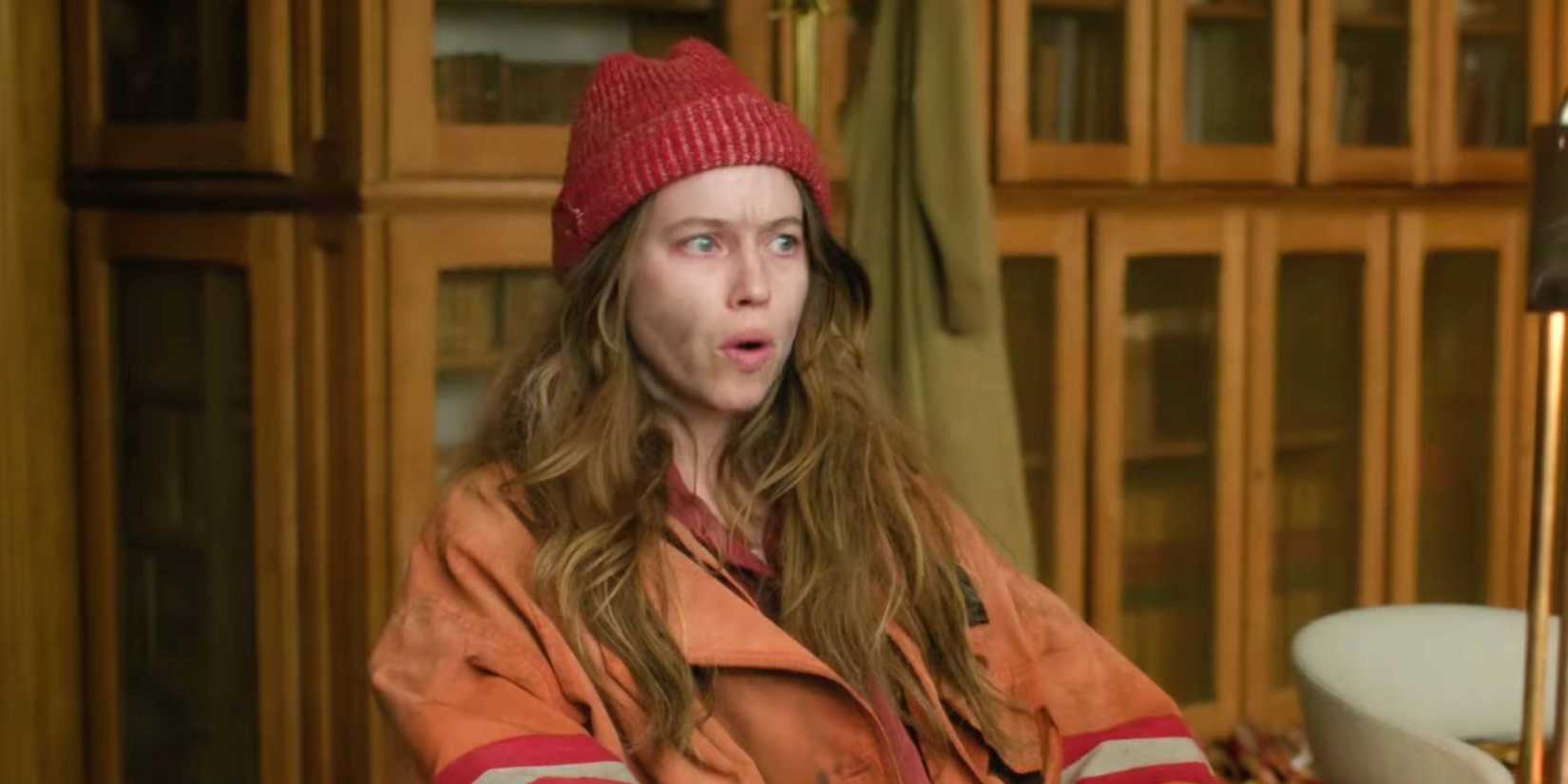 Etoile woman lookng perturbed wearing red hat