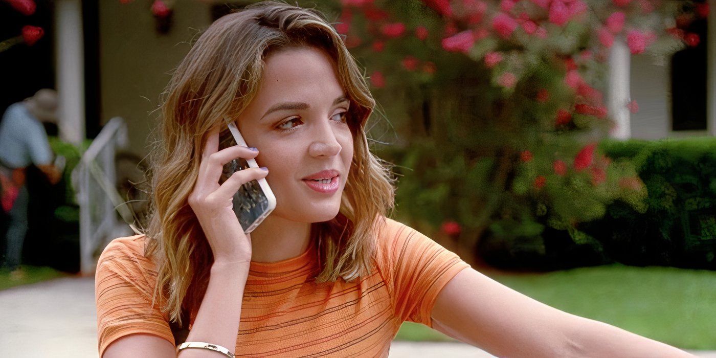 Georgie Flores talks on the phone while smiling in Famous in Love