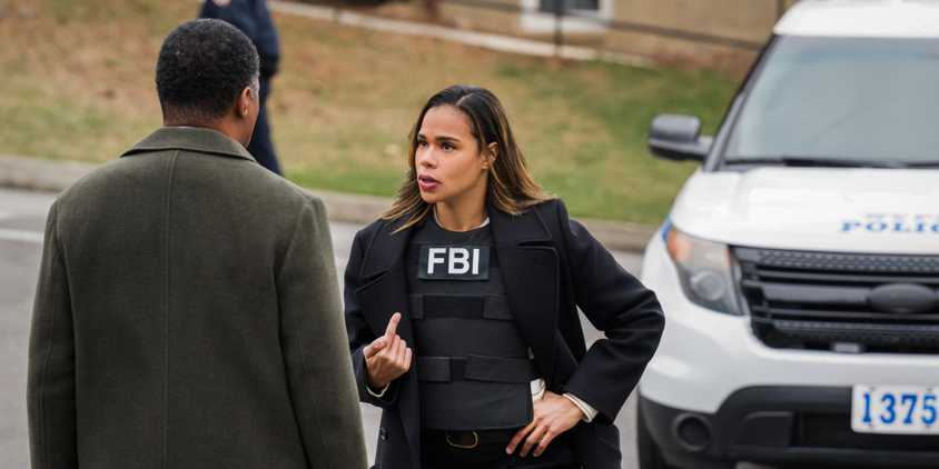 FBI Most Wanted Barnes pointing to herself while talking to someone outside