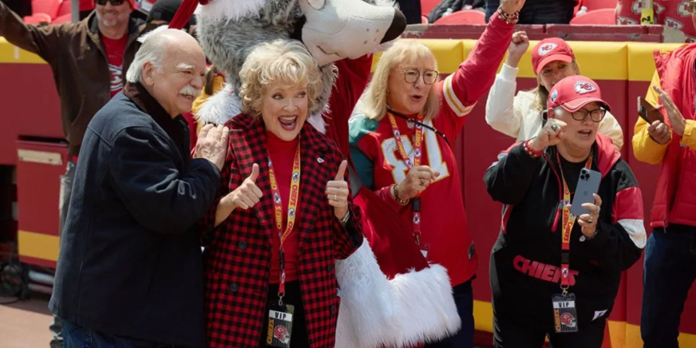 four chiefs fans Mary Elizabeth McDonough (second L) cheering in holiday touchdown a chiefs love story