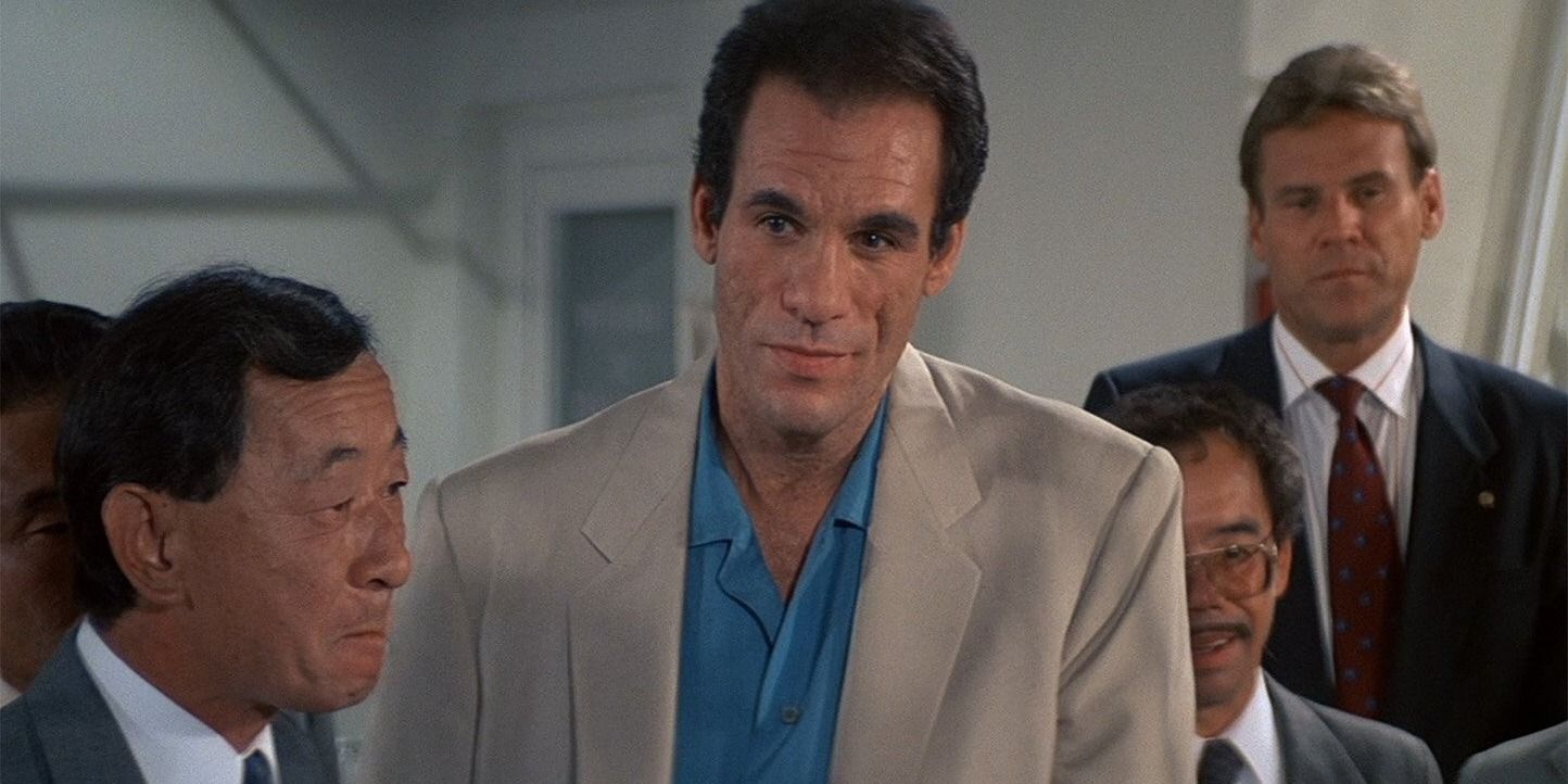 My Favorite Roger Moore James Bond Movie Deserved To Be So Much Better Franz Sanchez in License to Kill standing with a group of people