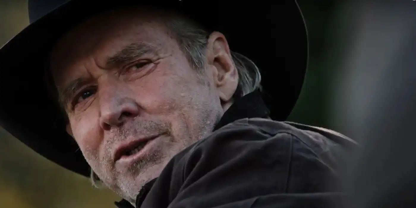 Garrett Randall (Will Patton) looking over his shoulder and talking in Yellowstone. copy