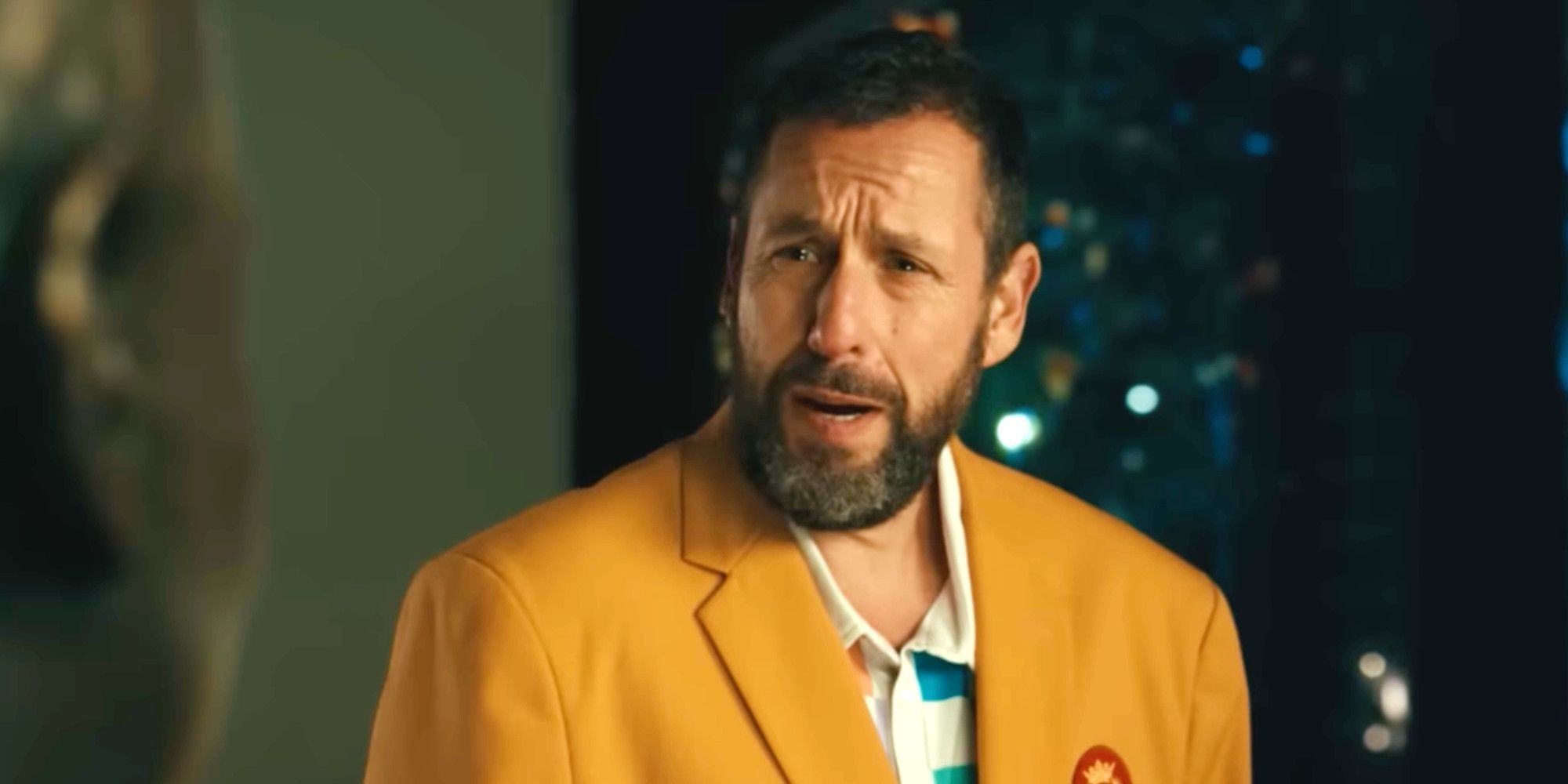 Happy Gilmore 2 trailer Adam Sandler in a yellow suit looking surprised 