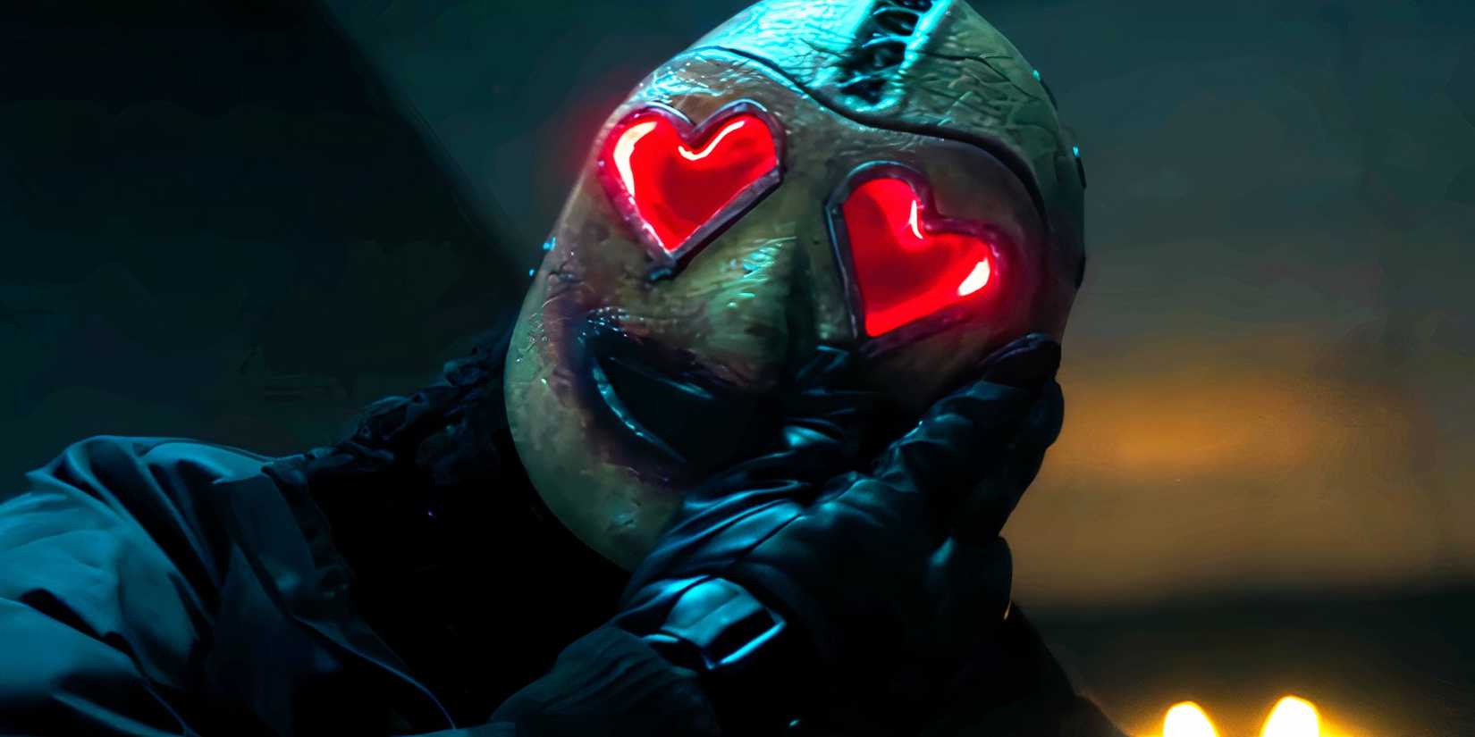 Heart Eyes Killer rubbing blood on his mask in Heart Eyes