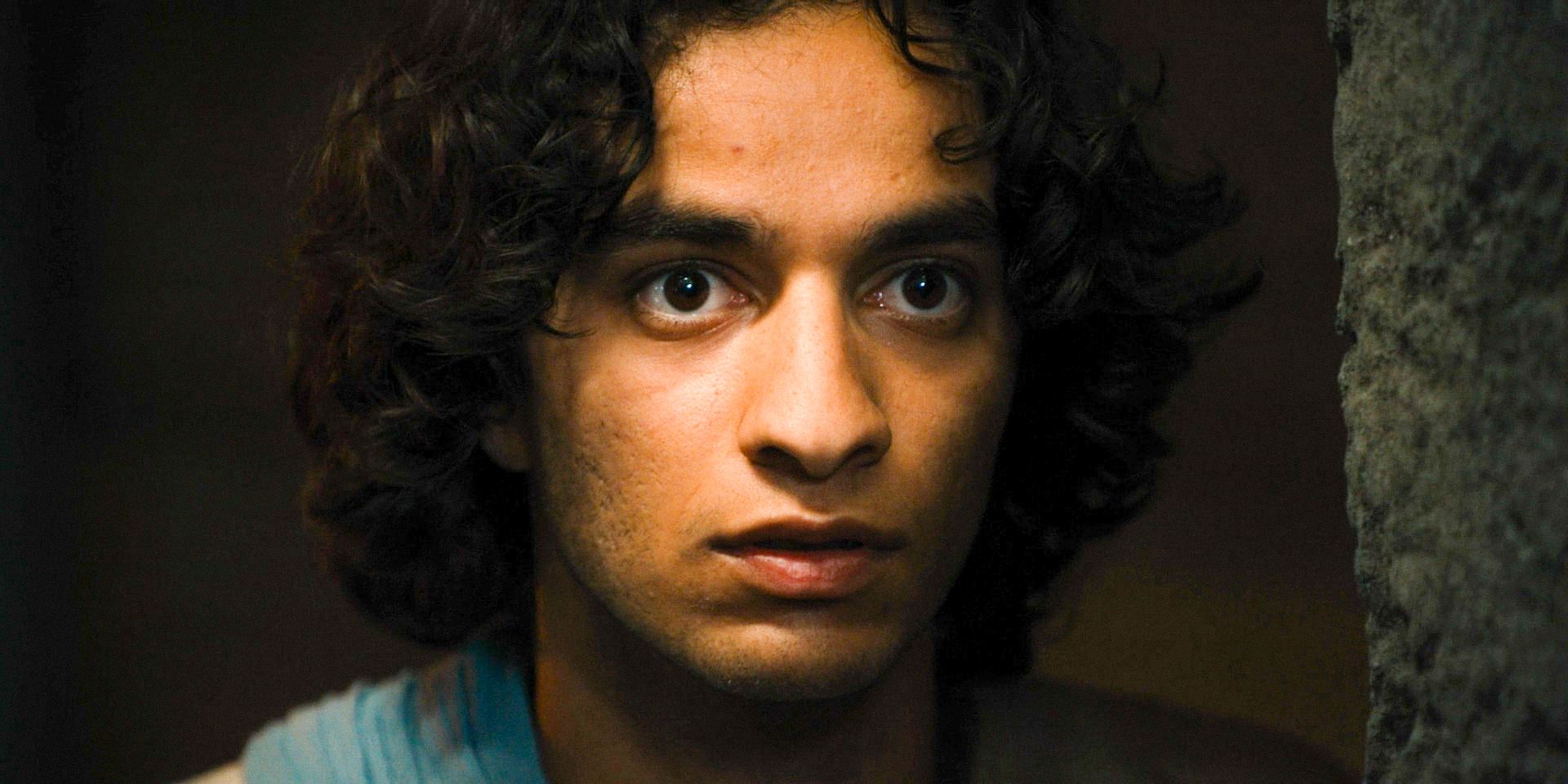 David (Michael Iskander) spying with a surprised expression in House of David Season 1 Ep 5