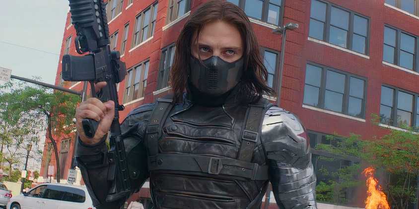Image of Sebastian Stan's Winter Soldier holding a gun in battle in Captain America Winter Soldier (2014)