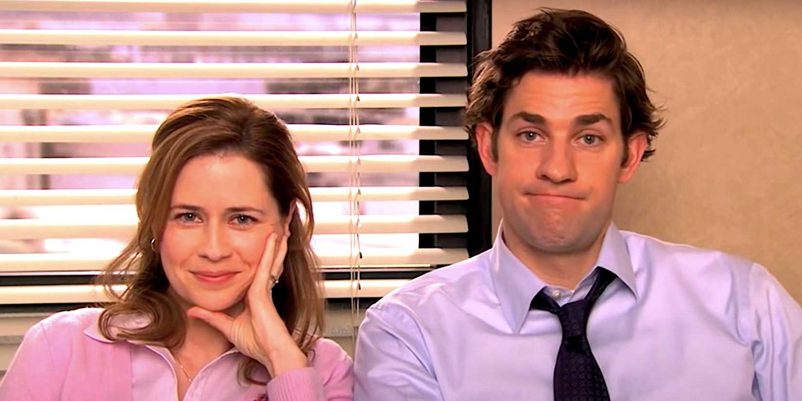 Jenna Fischer's Pam and John Krasinski's Jim look at the camera in The Office