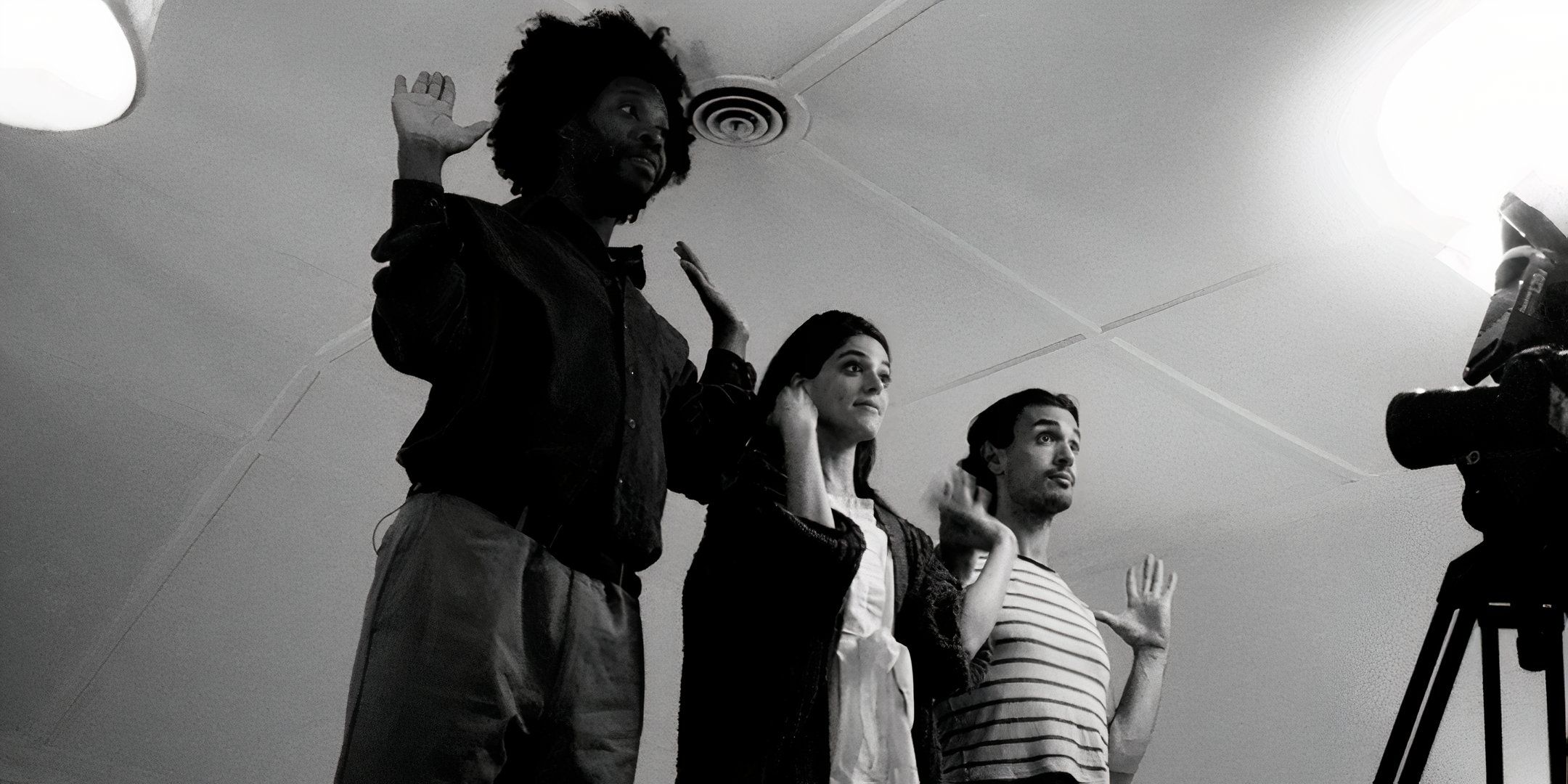 Jeremy O. Harris, Callie Fernandez and James Cusati-Moyer holding their hands up while rehearsing a scene for The True Beauty of Being Bitten by a Tick