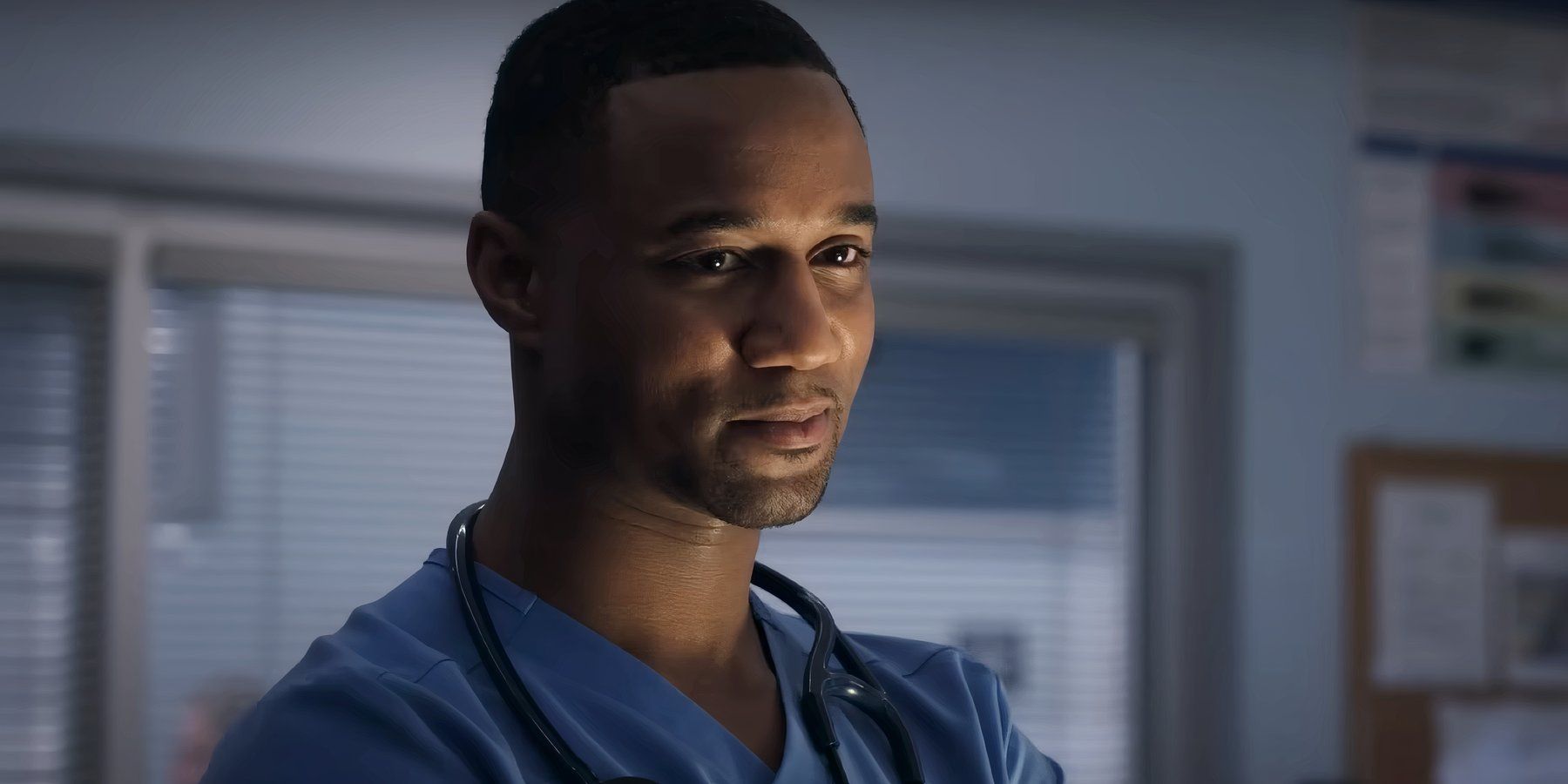 Jessie T. Usher smiling slightly at someone off camera on Pulse
