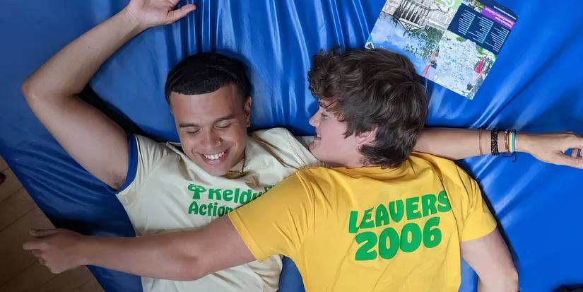 Joe Anders and Samuel Small laying on bed together in Bonus Track