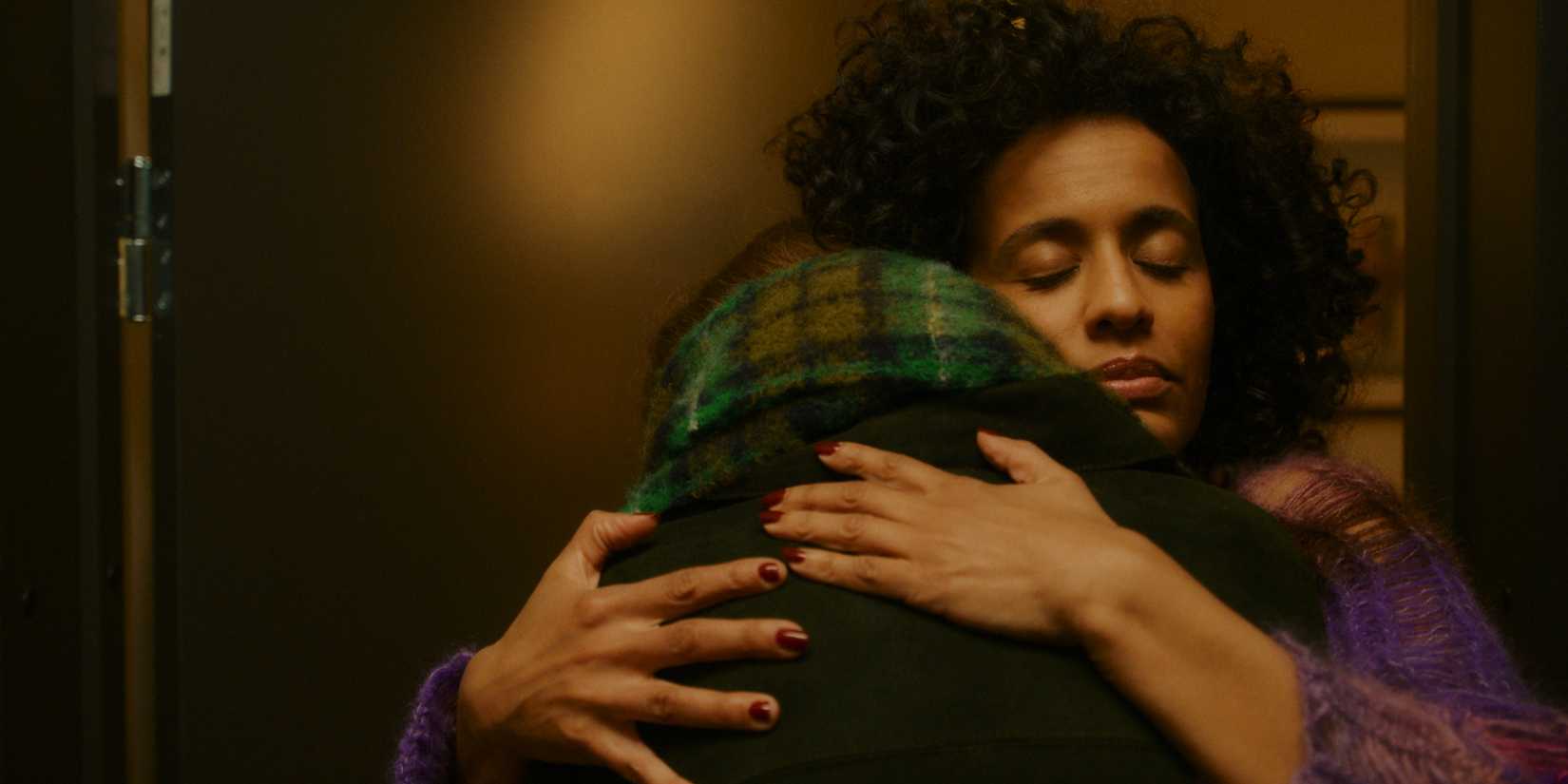 Johanna warmly hugging Johanne in a doorway in Dreams (Sex Love)