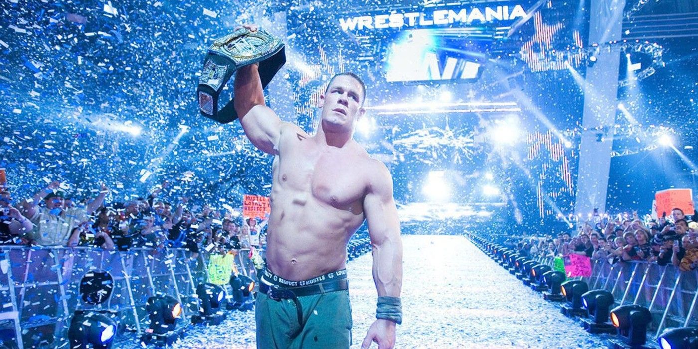 John Cena raises the WWE Championship in victory as confetti falls from Ford Field in Detroit Michigan at WrestleMania 23