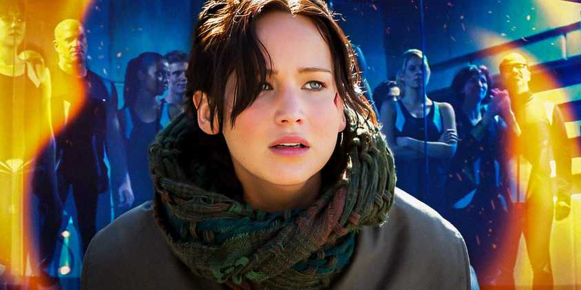 Katniss Everdeen looking upset and the tributes from the second Quarter Quell in the background in The Hunger Games: Catching Fire