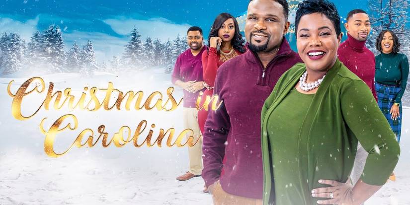 Kellie Williams and Darius McCrary smiling with the cast of Christmas in Carolina in a promotional image
