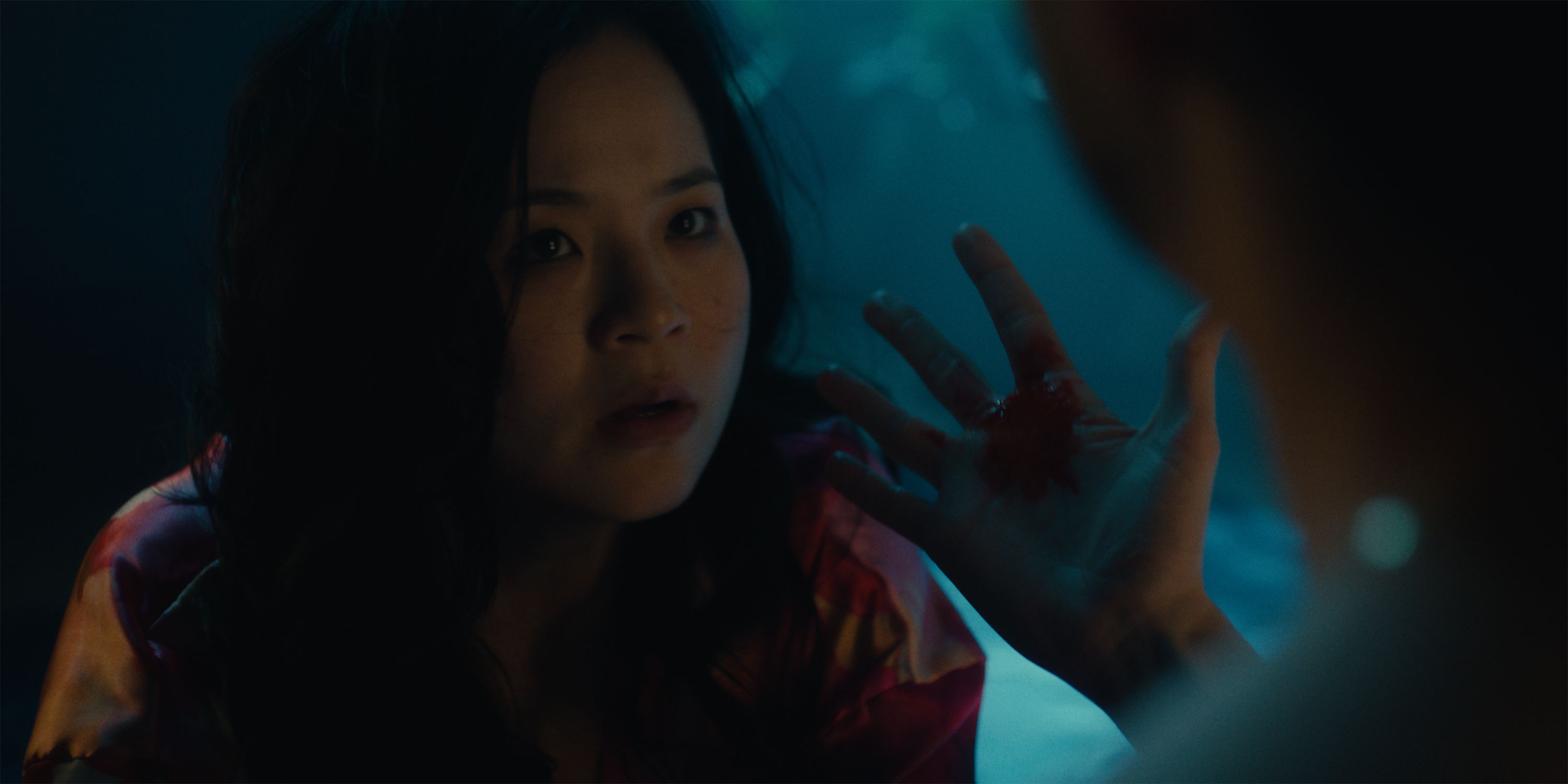 Kelly Marie Tran looking at a bloody hand in Control Freak