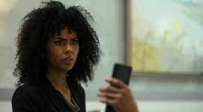 Lena looks at Olivia's phone in Beauty in Black