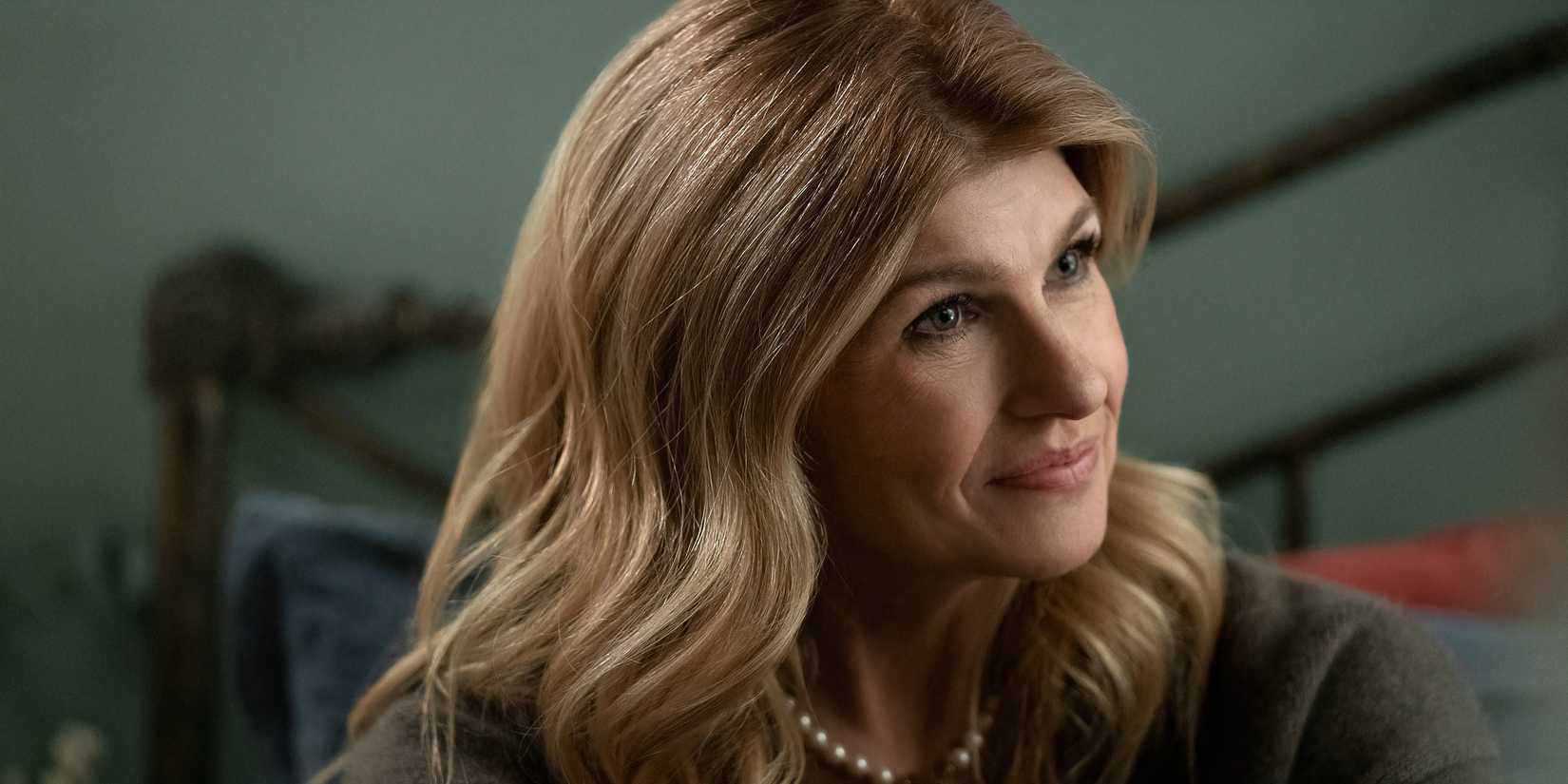 Connie Britton as Elizabeth looking to the side and smiling in The Life List.