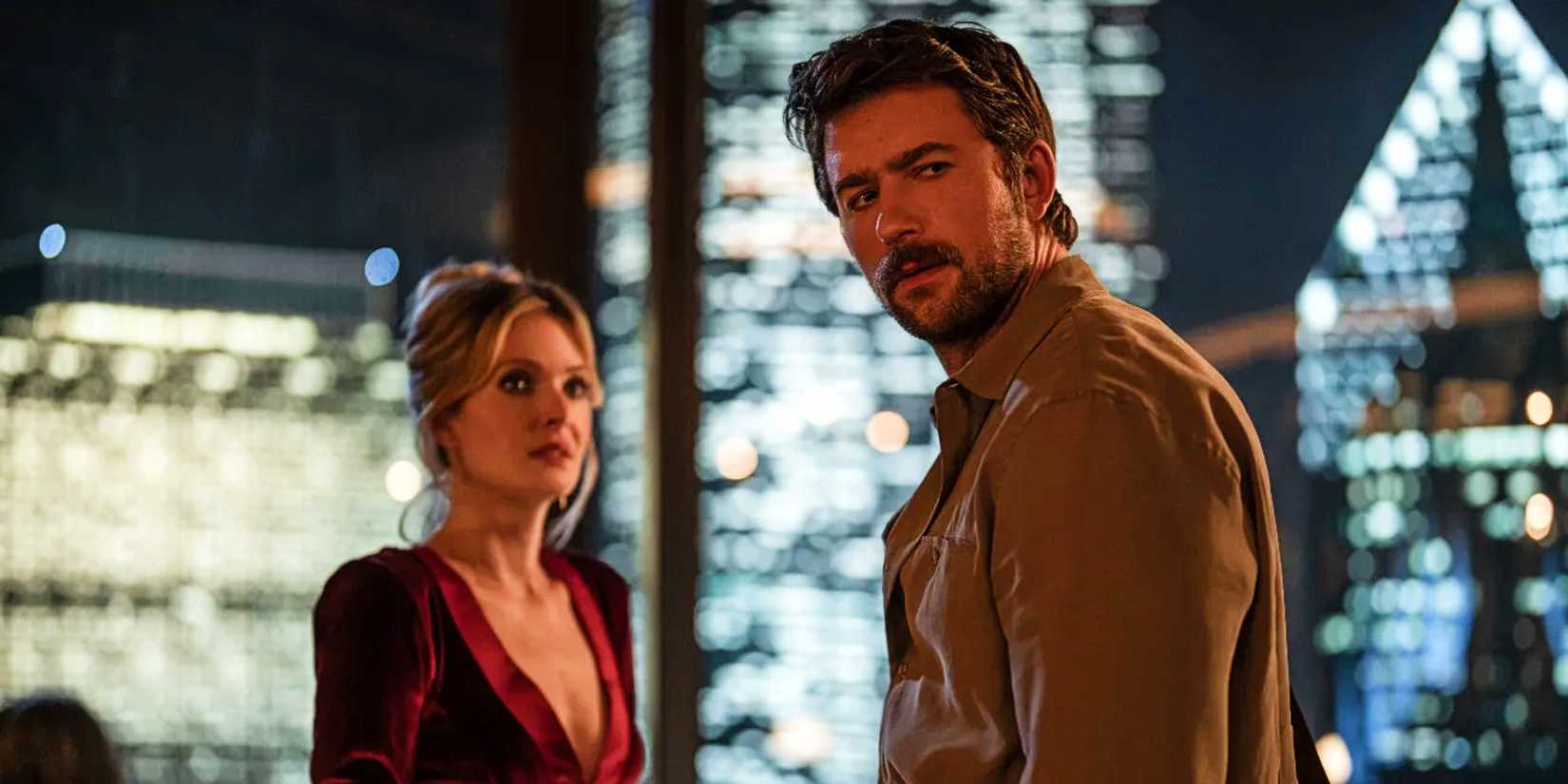 Meghann Fahy and Brandon Sklenar look out of frame in fear in Drop