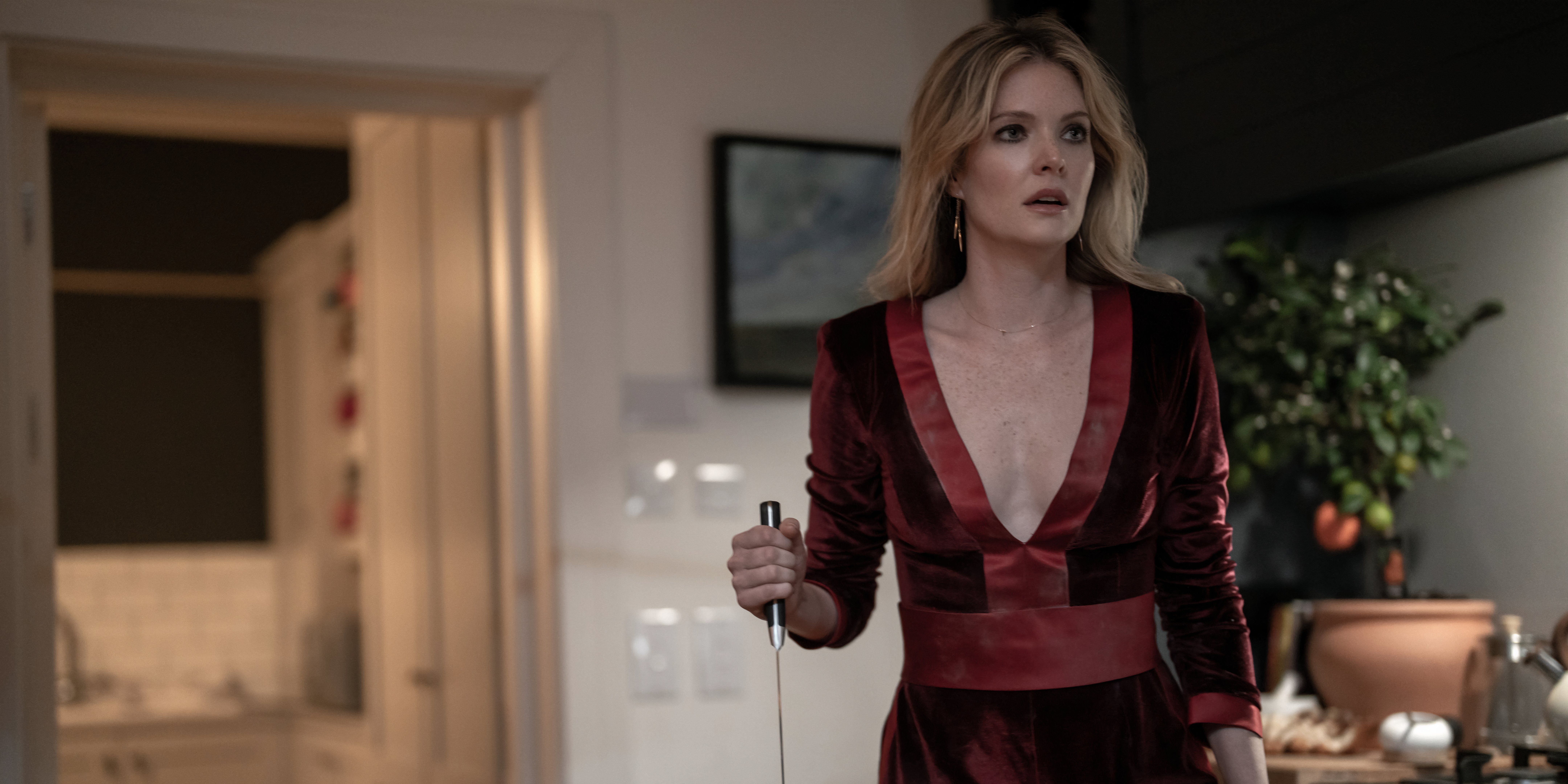 Meghann Fahy holds a knife in Drop