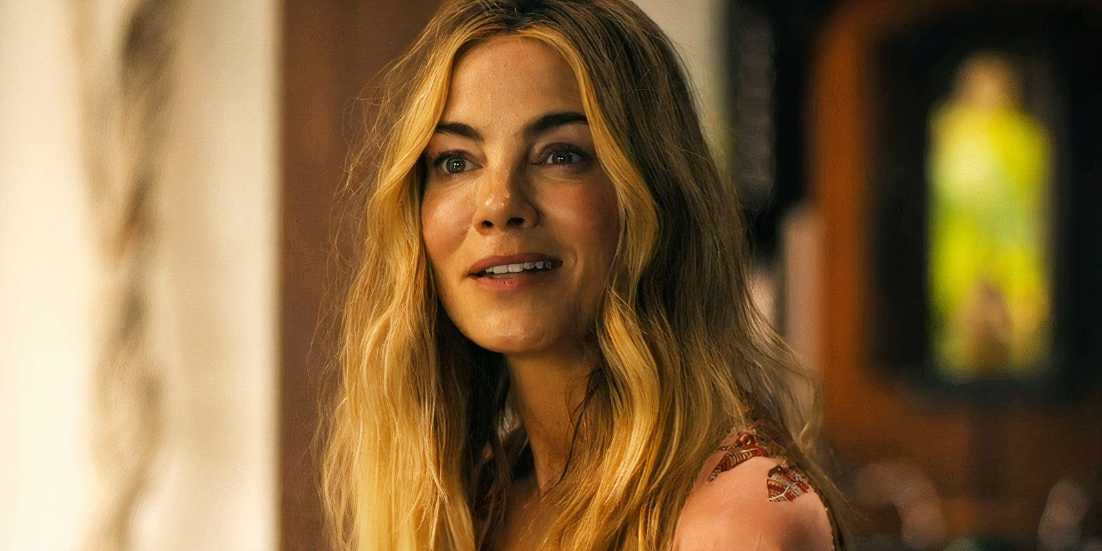 Michelle Monaghan smiling at her friend in The White Lotus season 3
