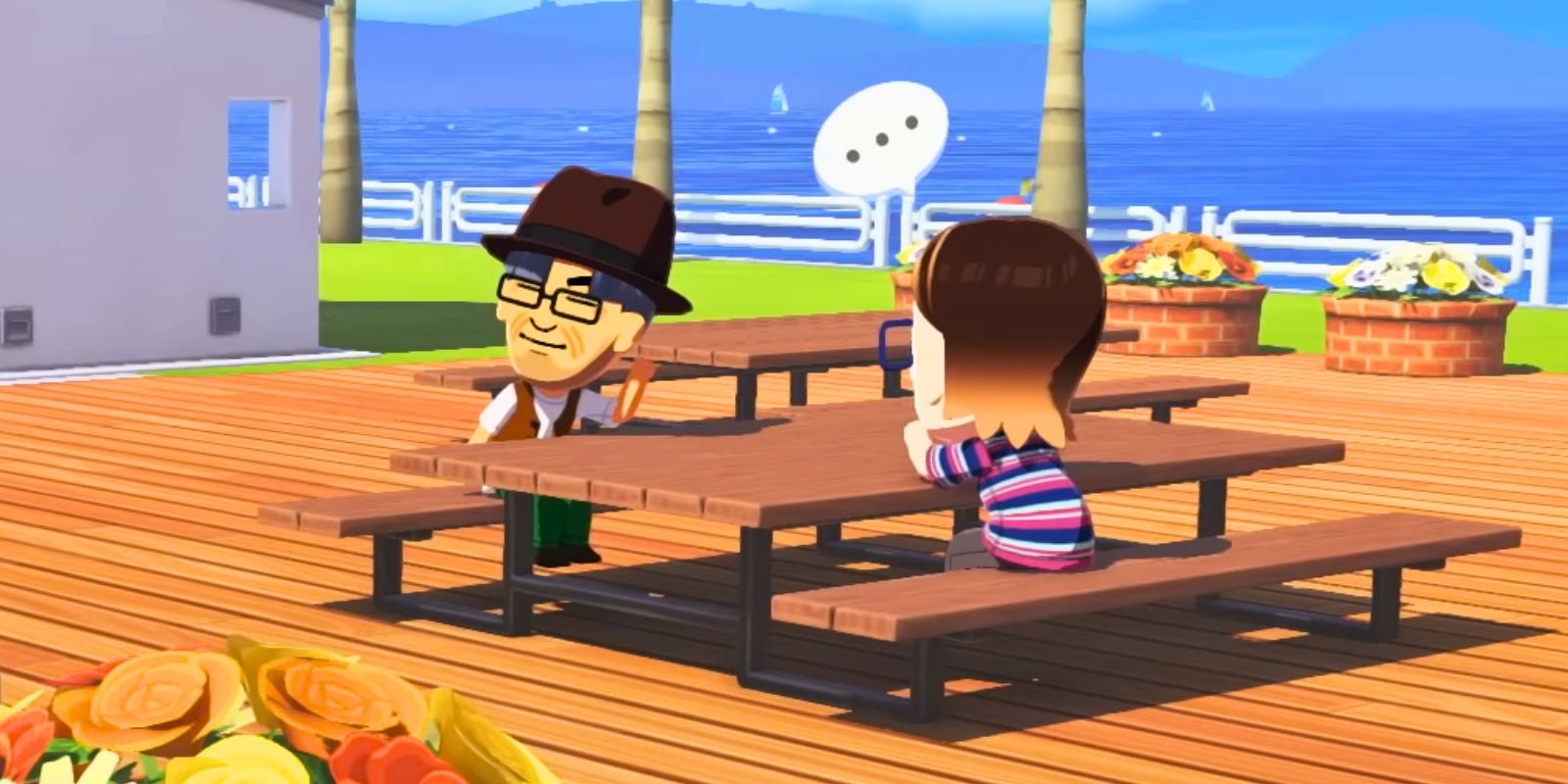 Fans Are Paying Big Money For The 3DS' Weirdest Game, So I'm Very Glad It's Getting A Switch 2 Sequel Miis having a conversation at a picnic table in Tomodachi Life_ Living The Dream