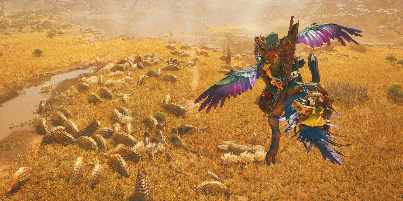 The player flying on a Seikret in Monster Hunter Wilds over a group of animals in the desert.