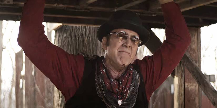 Nicolas Cage is screaming at someone while outside in Gunslingers