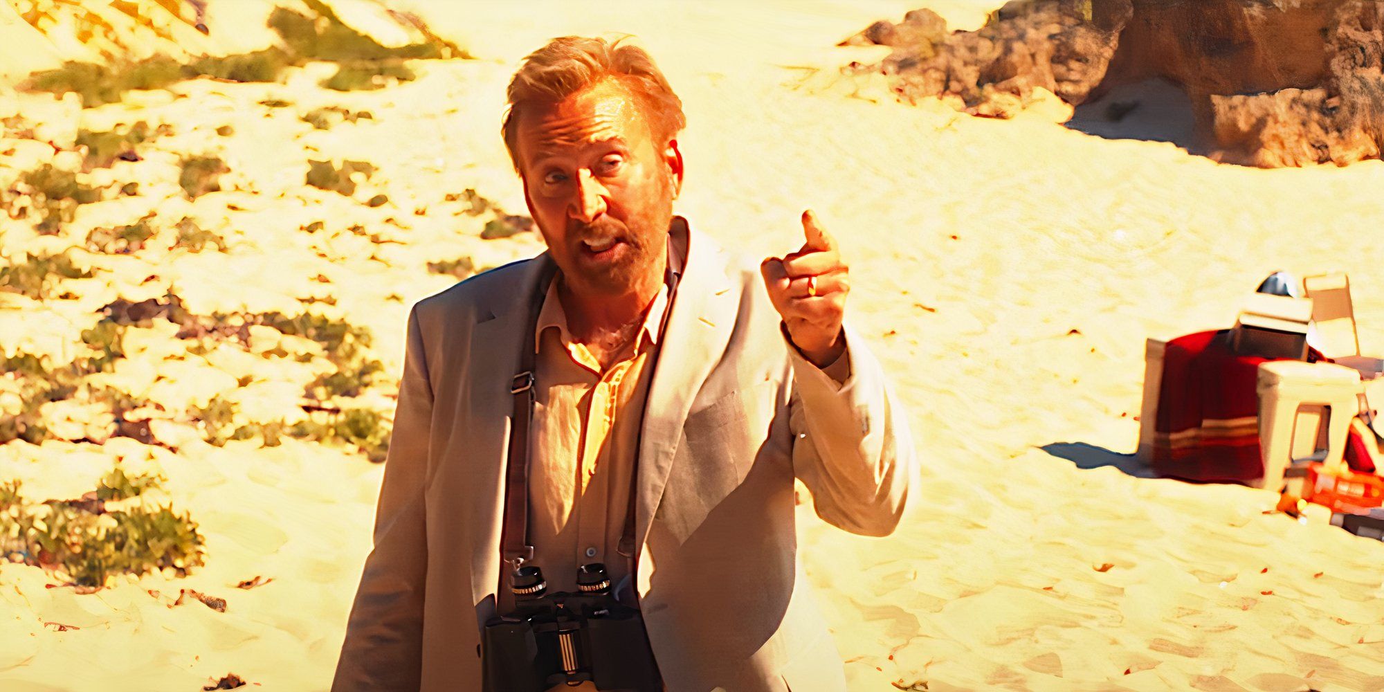 Nicolas Cage points his finger during a heated discussion in a scene from The Surfer