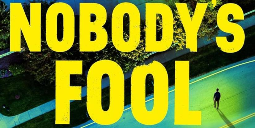 Nobody's Fool cover featuring the title in yellow block text and a man standing in the street facing trees and houses