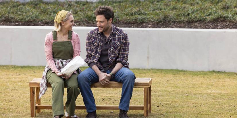 Alice and Brett smiling at each other in Grosse Pointe Garden Society