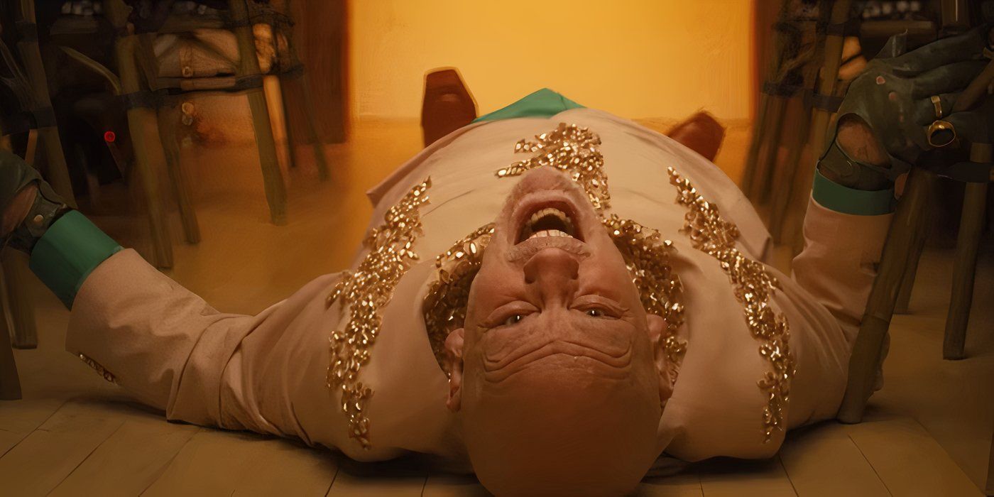 John Malkovich lying on his back as Moretti in Opus