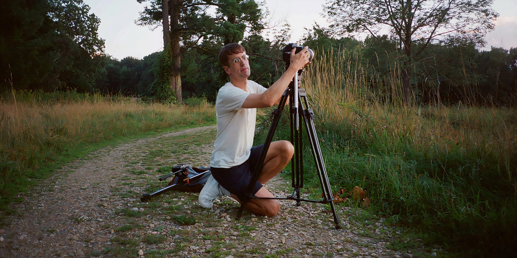 Pete Ohs adjusting his camera on The True Beauty of Being Bitten by a Tick set